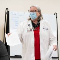 Professor in classroom with students